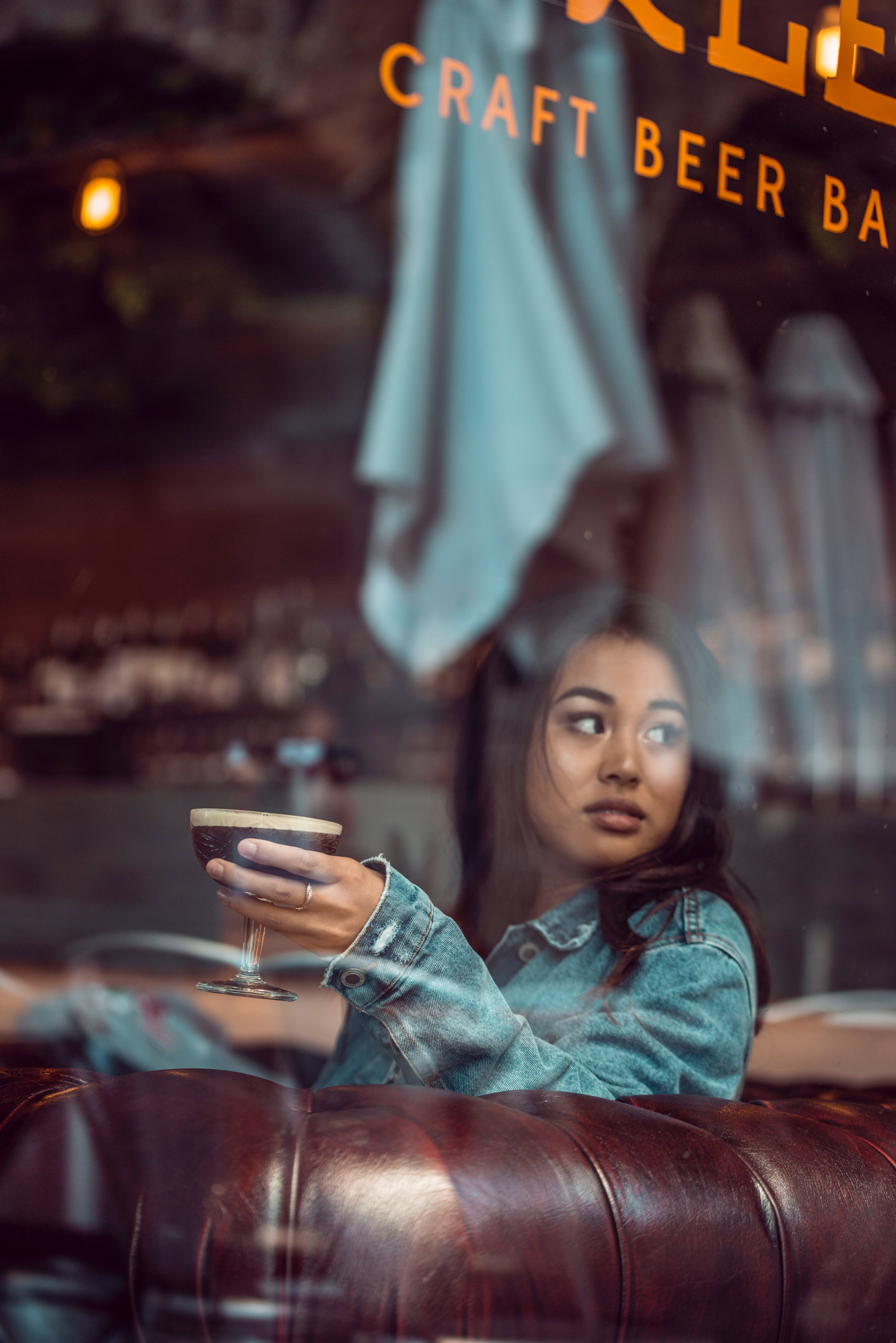 Woman with Beer in Pub - Joren Aranas